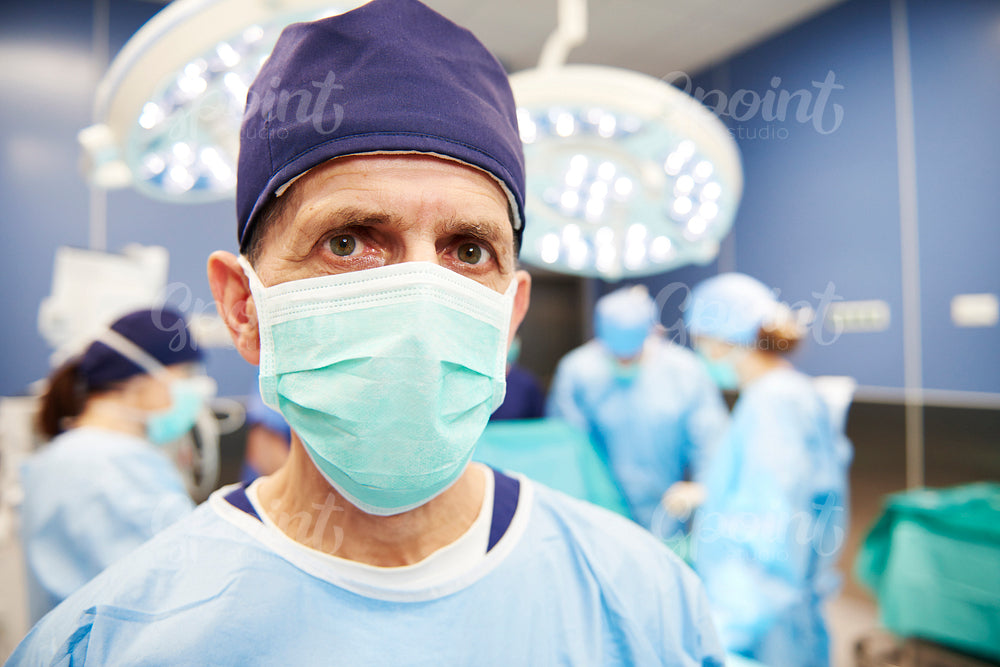 Portrait of senior surgeon in operating room