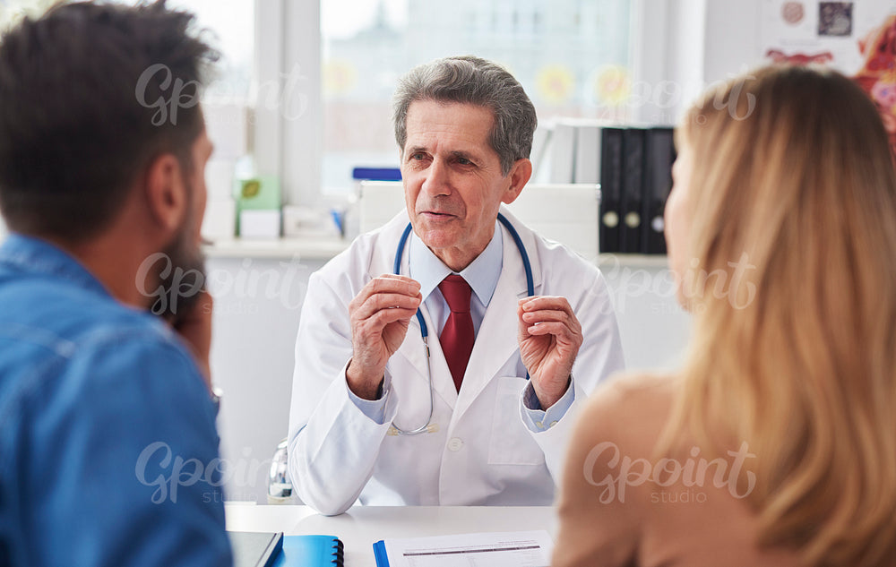 Conversation between doctor and young couple