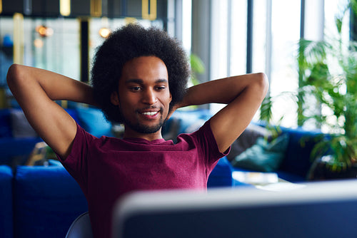 Young, african american man relaxing in the office