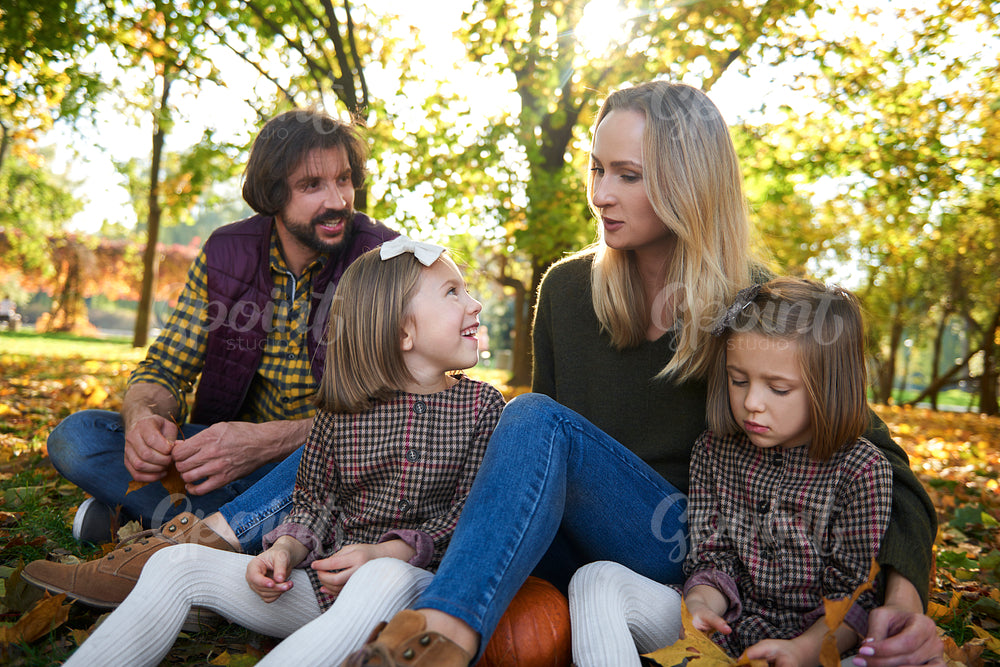 Happy family in autumn woods