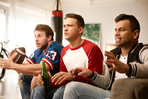 Unhappy men while watching american football