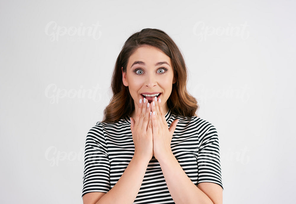 Shot of excited woman in studio shot