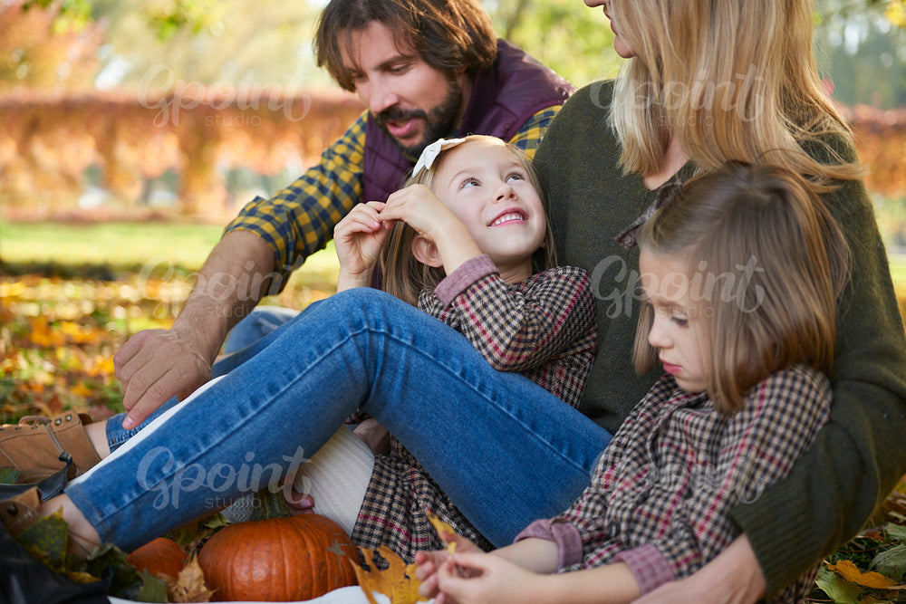 Parents with children in autumn woods