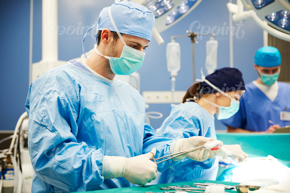 Surgeon using medical scissors while an operation