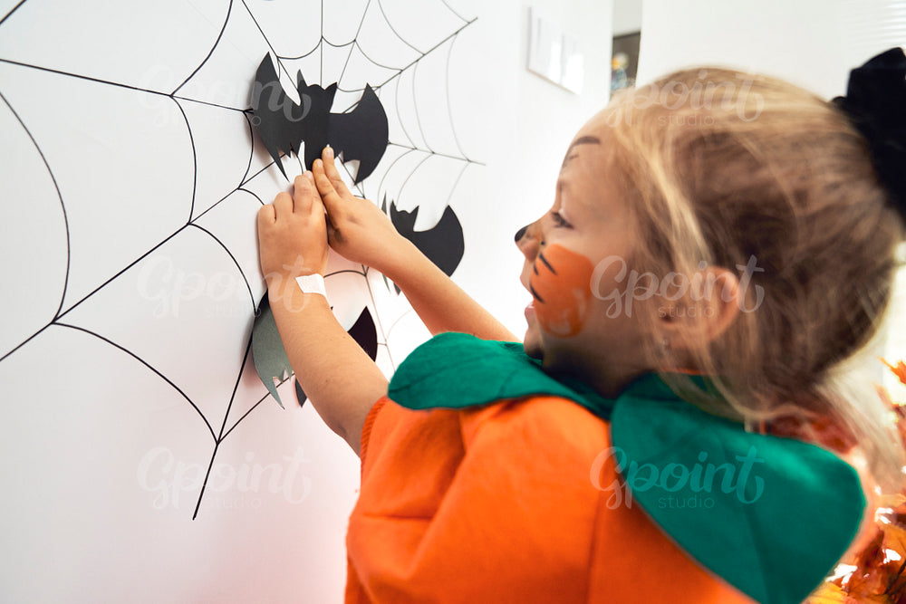 Little girl playing at Halloween party