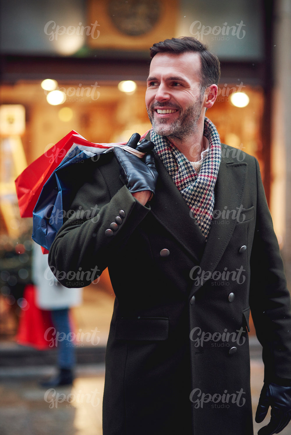 Man with full shopping bags