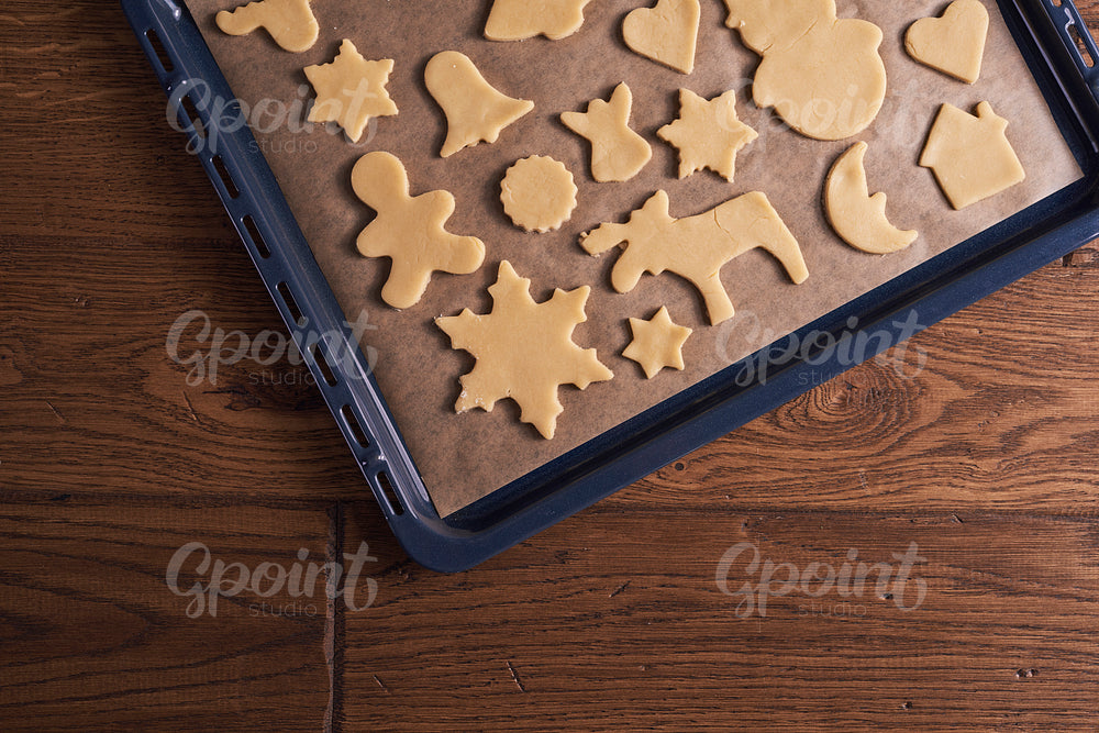 Arrangement of gingerbread cookies on cookie sheet