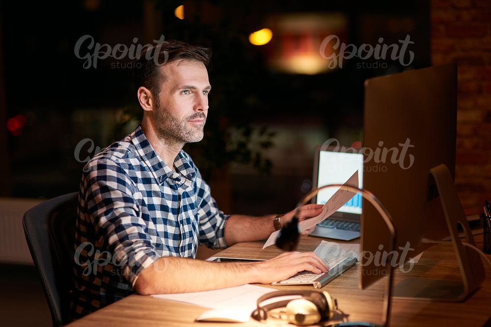 Man working with technology at night