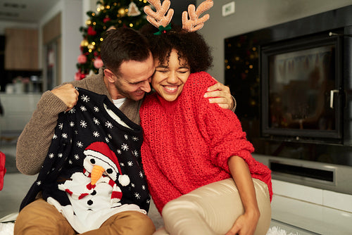 Affectionate couple embracing at Christmas