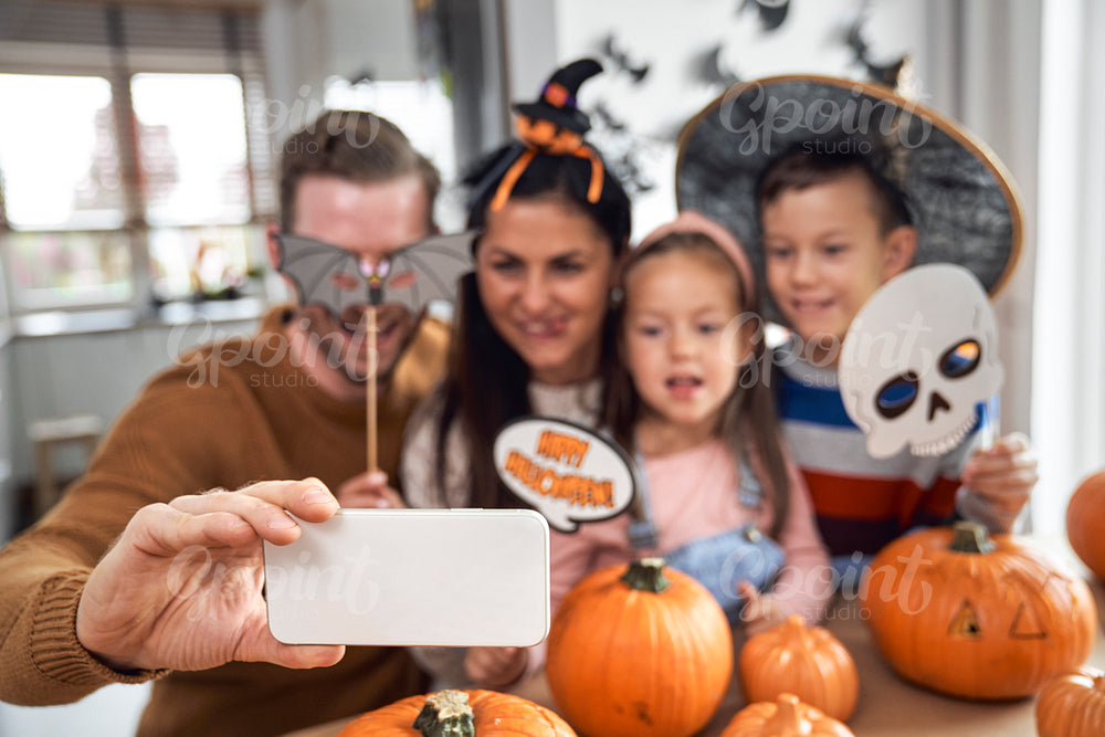 Family making selfie in Halloween 