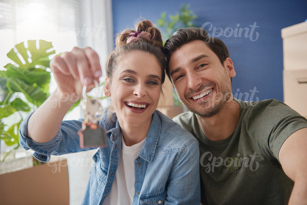 Young couple holding a bunch of home keys
