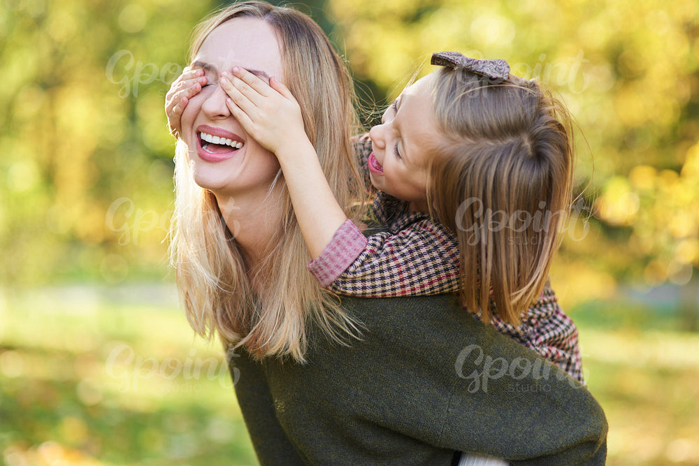 Happy child having fun with mommy on fresh air
