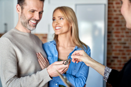 Close up of couple receives the keys to a new apartment
