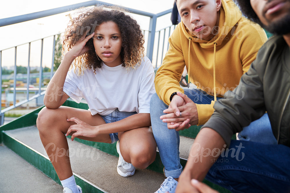Portrait of serious young people outdoors