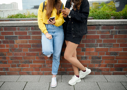 Modern young girls using mobile phone