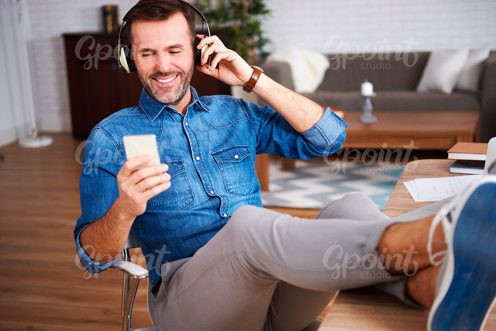 Mature men listening to music and resting