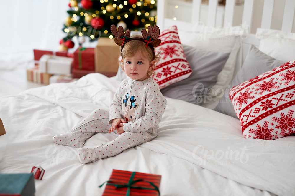 Portrait of charming baby in Christmas morning