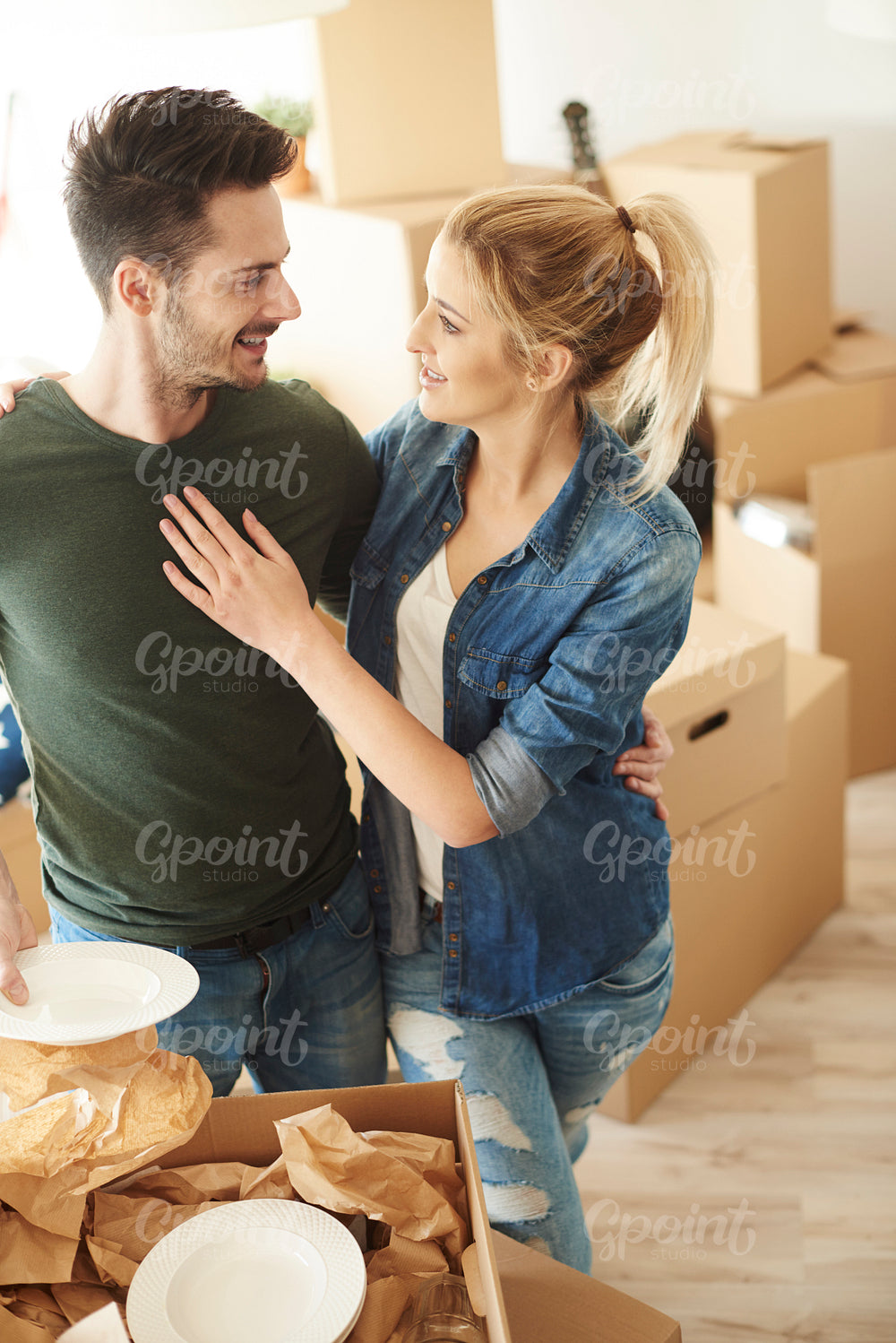 Happy couple moving into new house