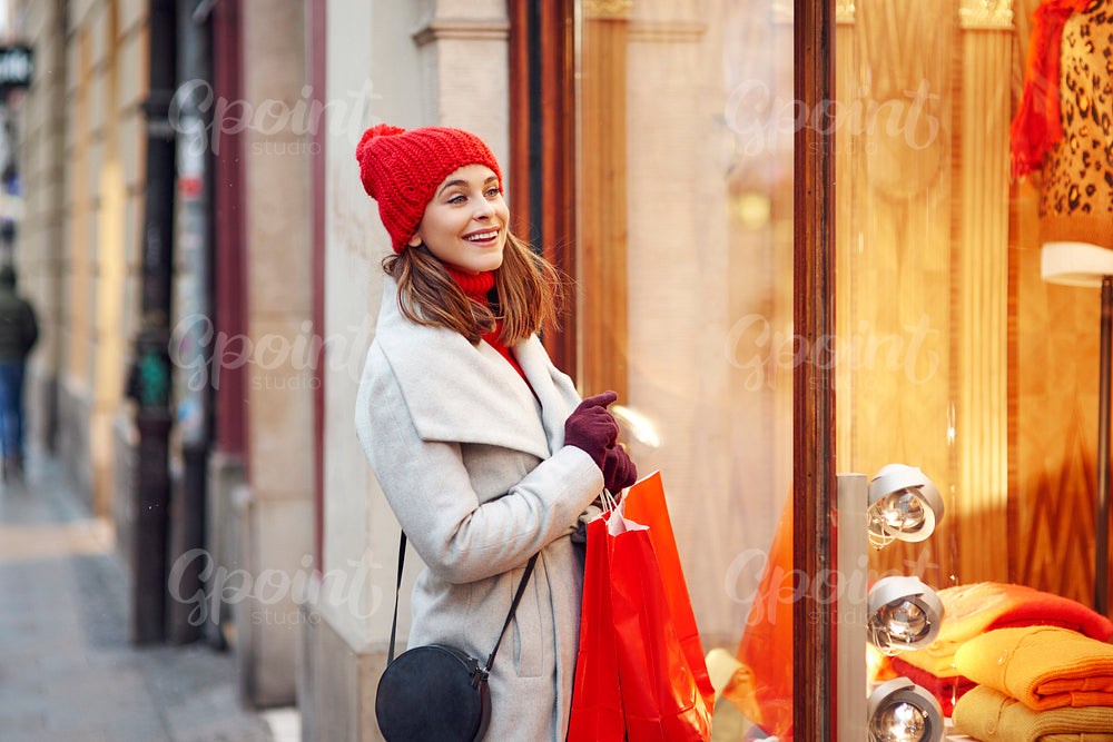 Woman looking through the stores window