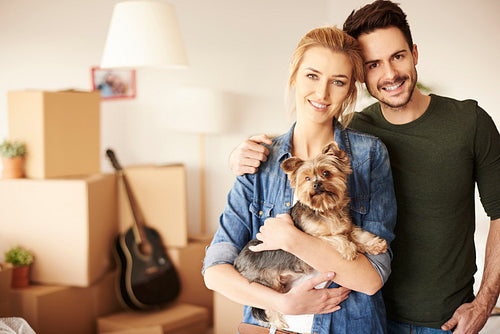 Portrait of couple with small pet
