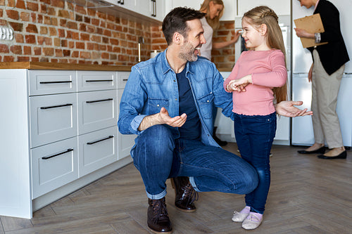 Happy father with cute daughter in new apartment